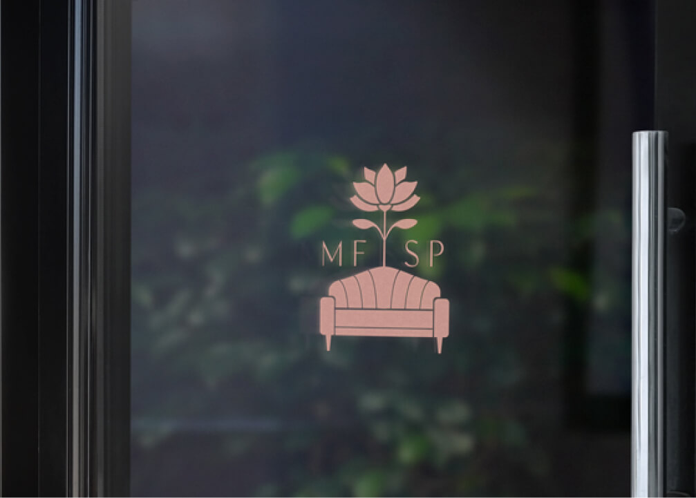 Glass door decal showing a pink lotus flower above a stylized sofa icon with the letters ‘MFSP’